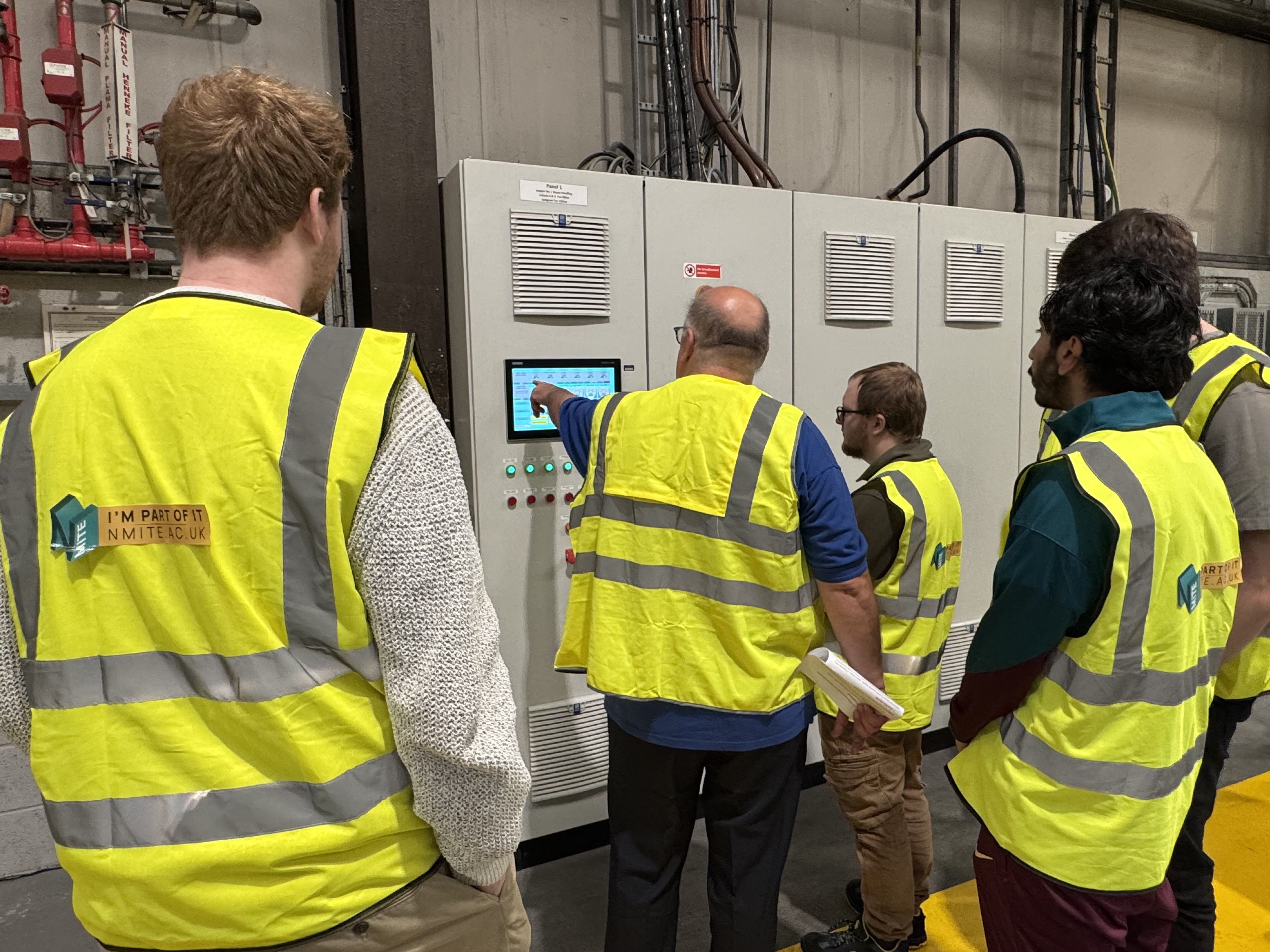 NMITE Students on a visit to Kingspan wearing branded Hi-vis