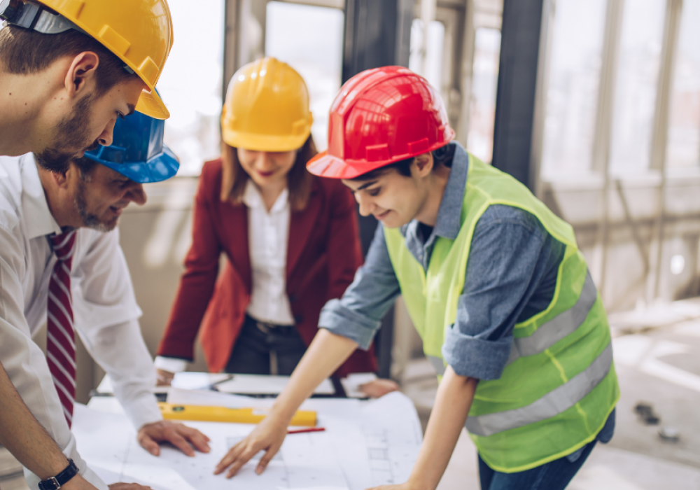 Men and women in construction and engineering conversation