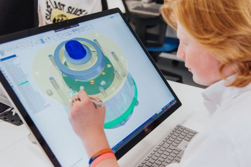NMITE integrated engineering student doing 3D design on a laptop