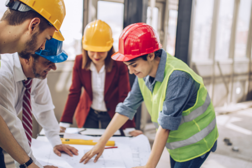 Men and women in construction and engineering conversation