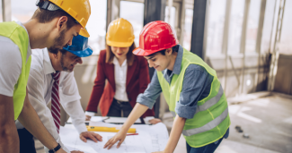 Men and women in construction and engineering conversation