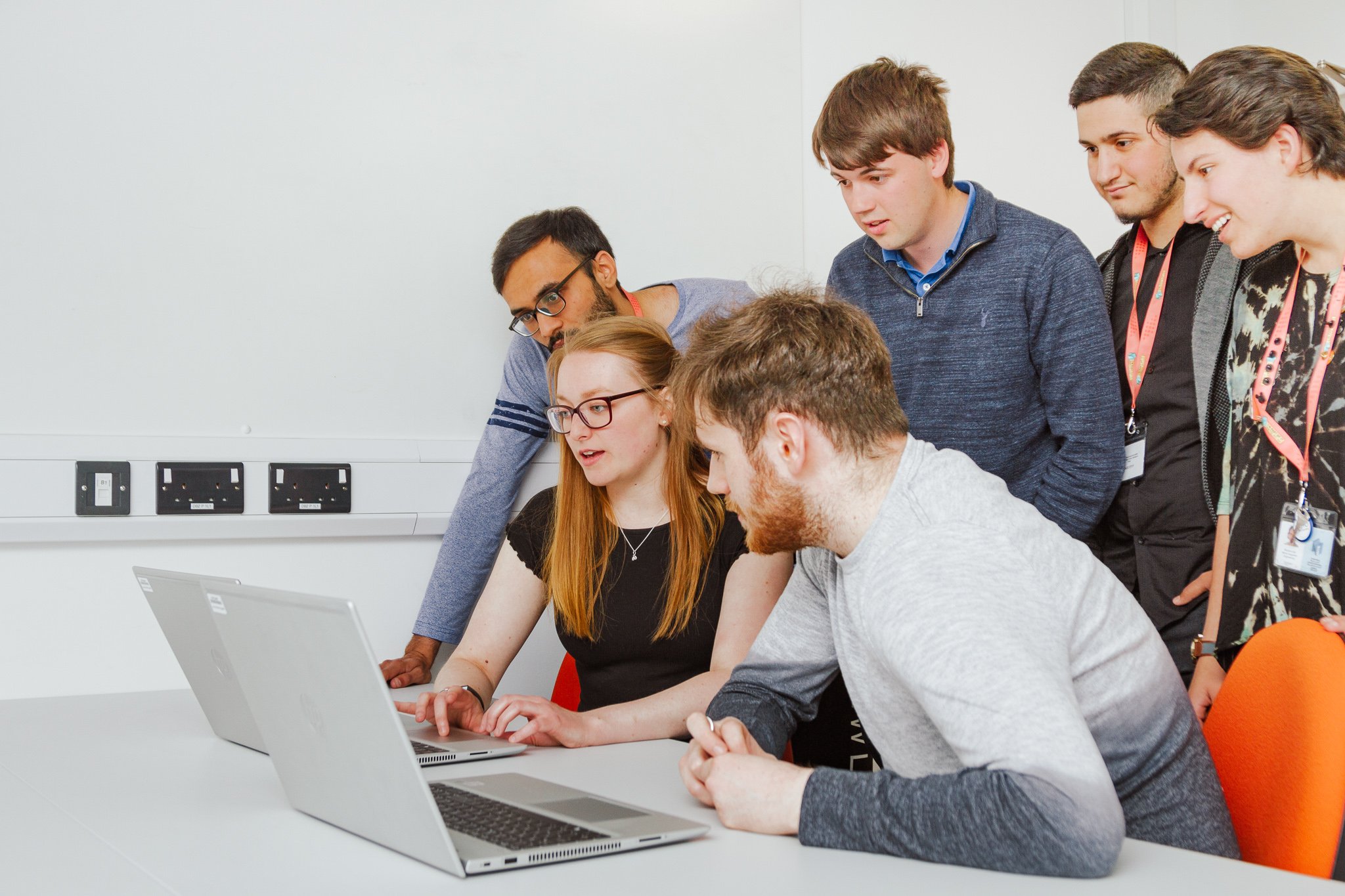 NMITE Students gathered around a laptop