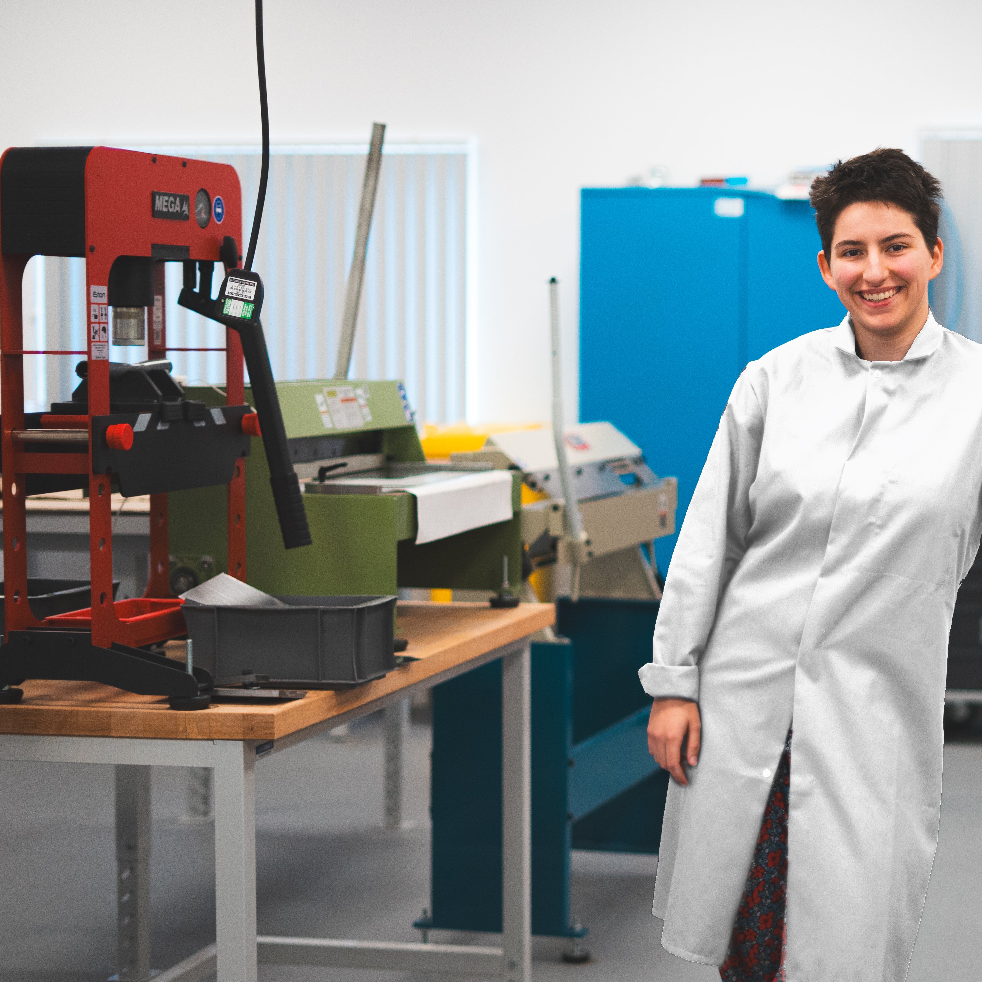 NMIYTE student in the factory with a white lab coat